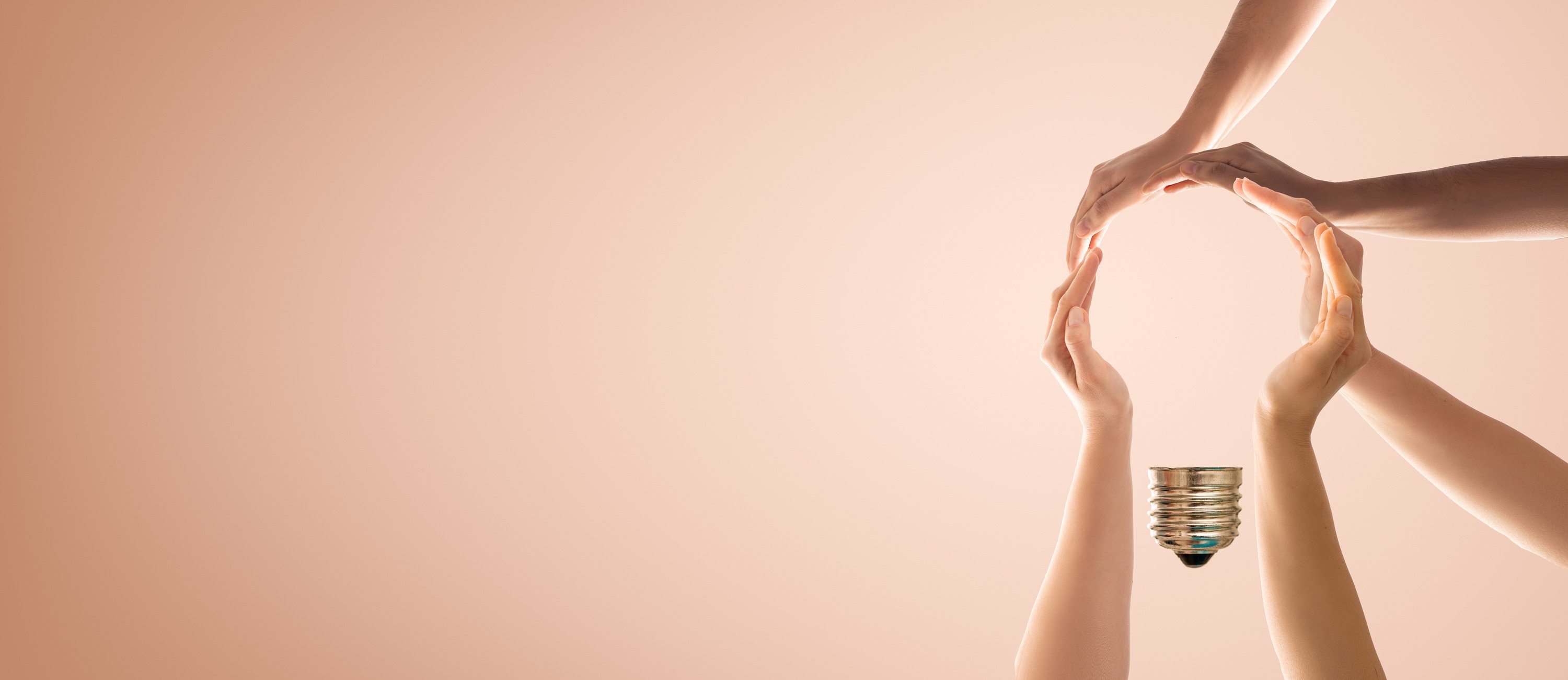 Teamwork and Creative Solution Concept with Hands Forming Lightbulb